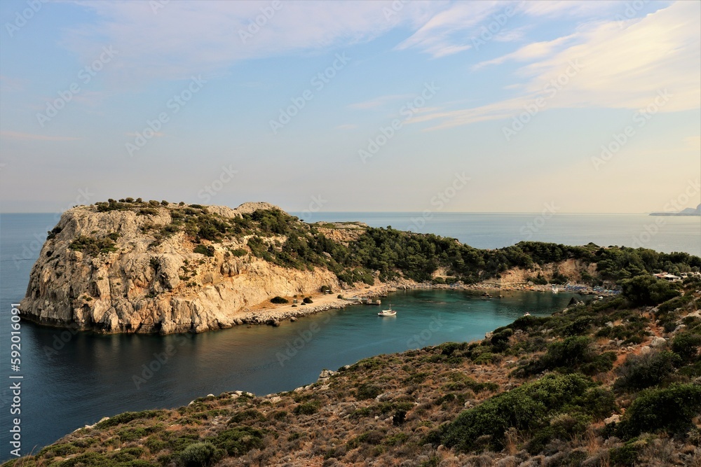 small bay surrounded by rocks on Rhodes island, Greece in the summer