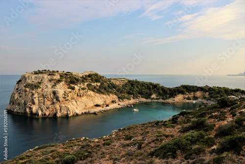 small bay surrounded by rocks on Rhodes island, Greece in the summer