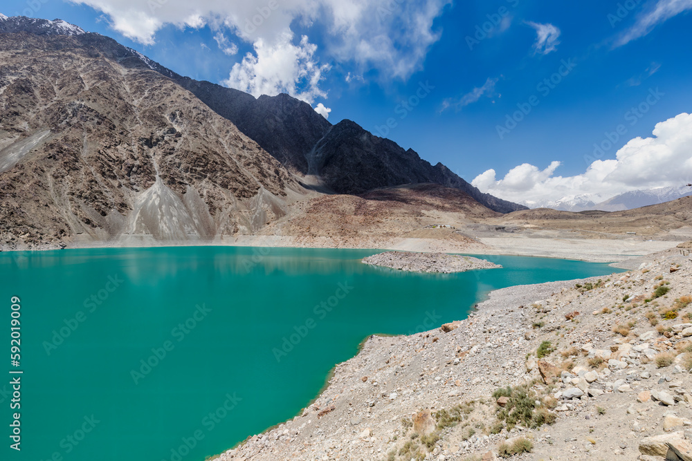 Serene beauty of Satpara or Sadpara Lake with its turquoise waters, a stunning natural wonder nestled near Skardu in Gilgit-Baltistan, Pakistan. 