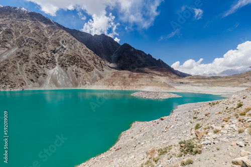 Serene beauty of Satpara or Sadpara Lake with its turquoise waters, a stunning natural wonder nestled near Skardu in Gilgit-Baltistan, Pakistan.  photo