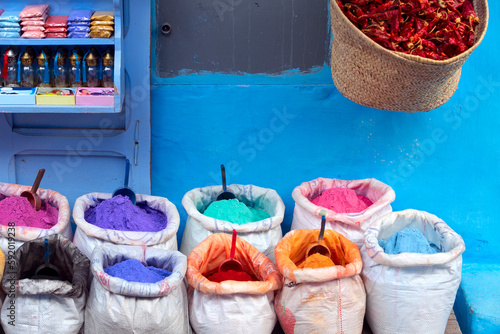 Colorful spices and dyes in the street of the blue city, Chefchaouen, Morocco. © minoandriani