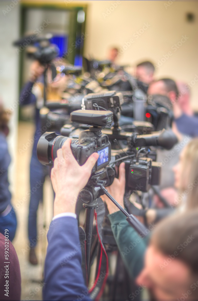 cameraman filming an interview cameraman filming an interview