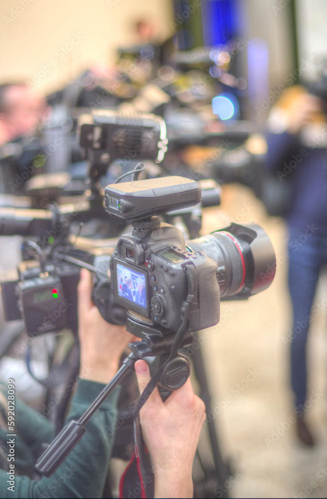 cameraman filming an interview cameraman filming an interview