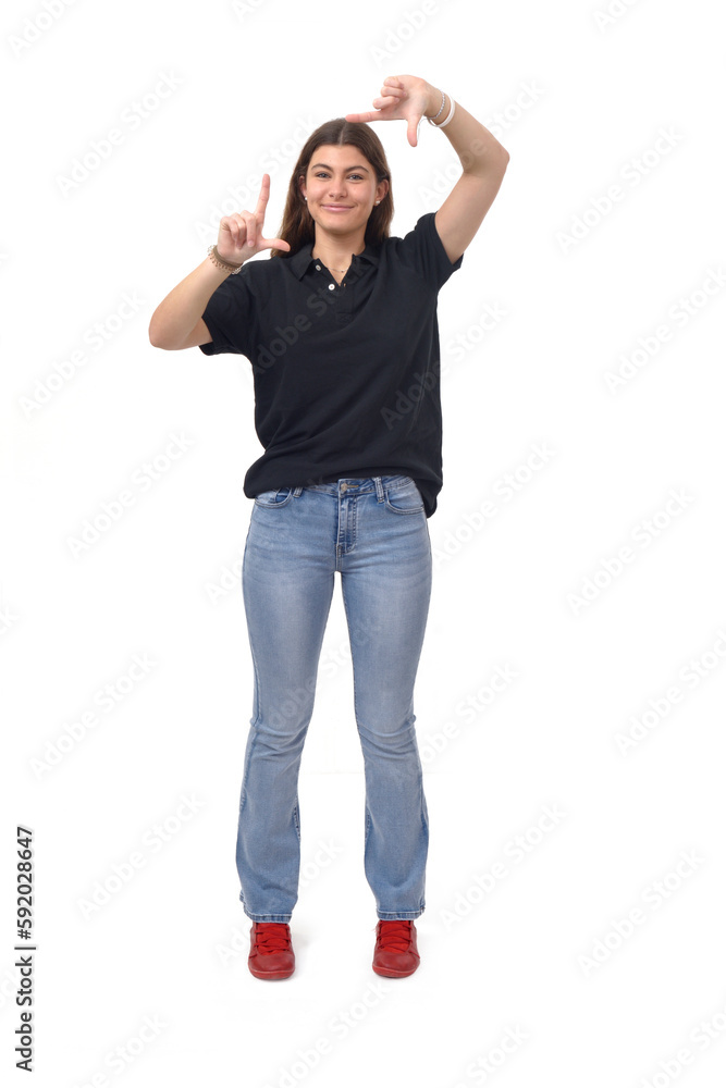 front view of a young girl framing with his hands on white background front view of a young girl framing with his hands on white background