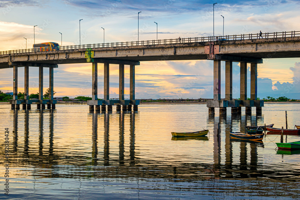 a beautiful sunset over a river bridge in the city of Fortaleza-CE