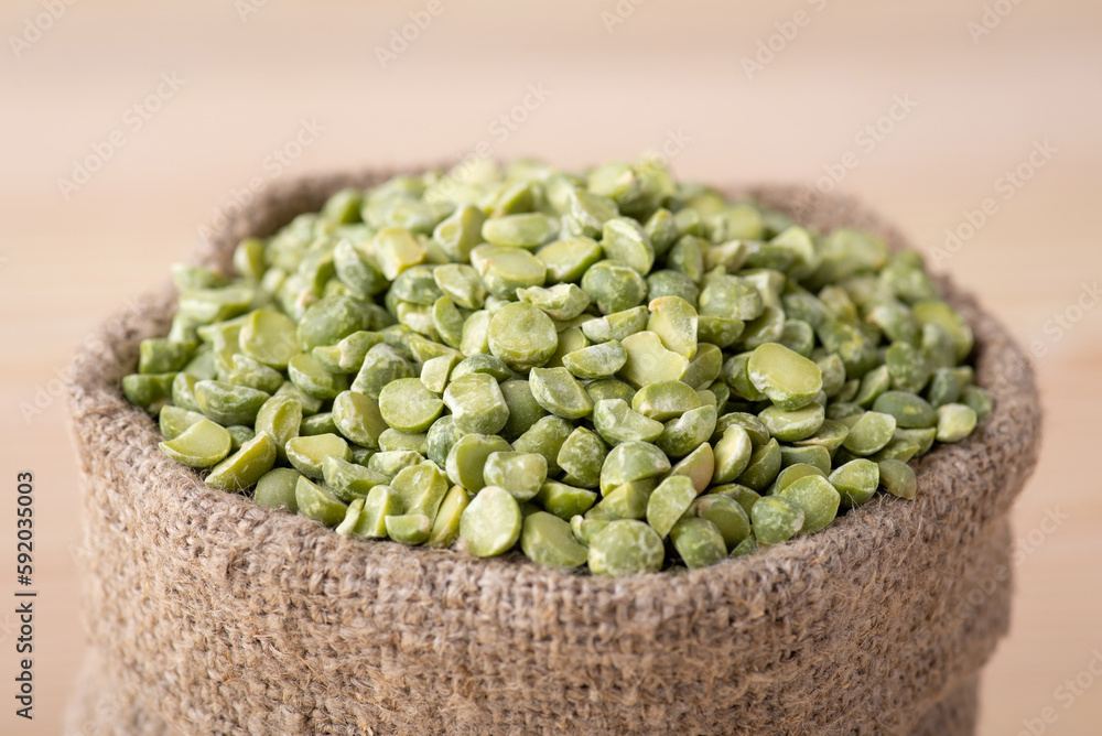 Macro shot of green pea grain in linen sack Macro shot of green pea grain in linen sack