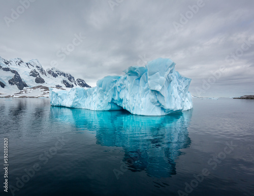 Impressive iceberg with blue ice in Antarctica, scenic landscape in Antarctic Peninsula 