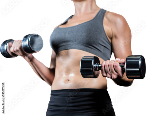 Muscular woman lifting heavy dumbbells