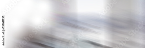Blurred motion of bicycle by glass window in office