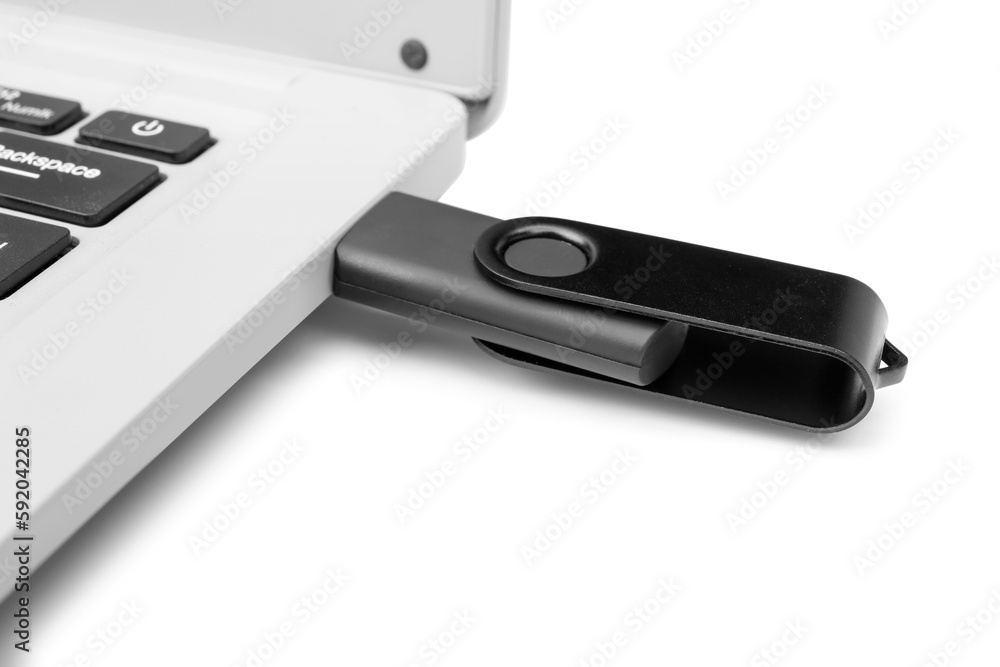 Laptop with black USB flash drive isolated on white background Laptop with black USB flash drive isolated on white background