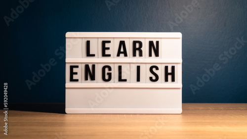 Learning English concept. Learn English message on white letter board. Language learning concept background.