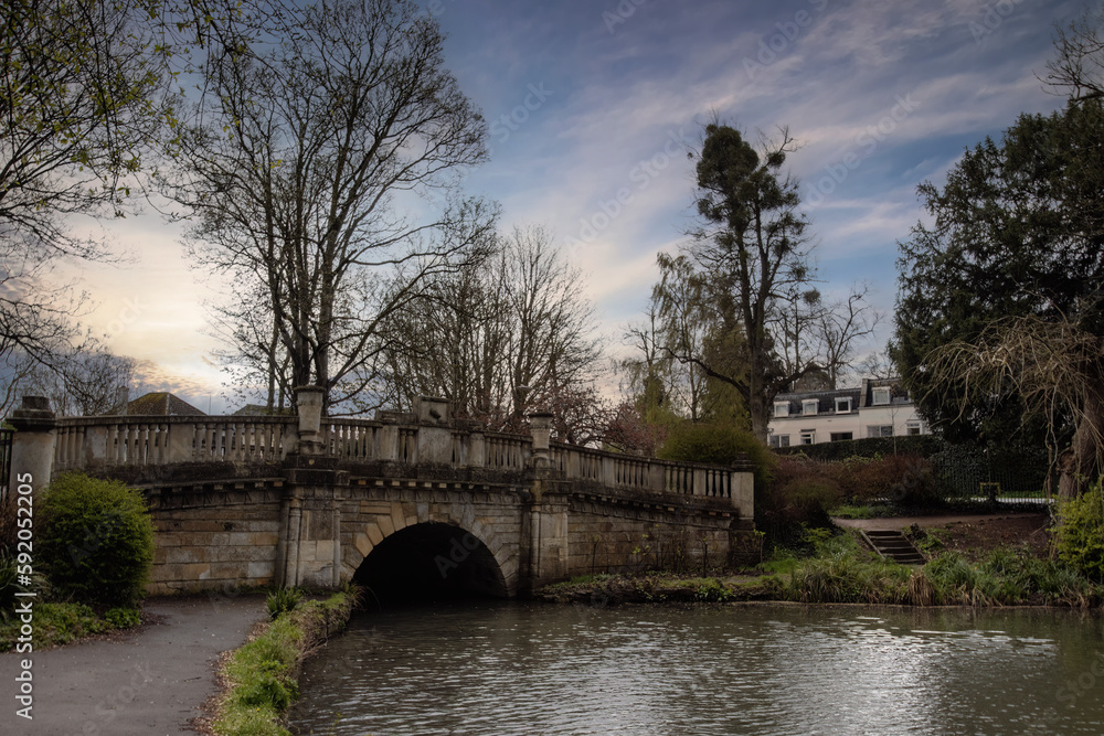 A small stone bridge in Pitville Park in Cheltenham, Gloucestershire, UK
