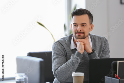 Handsome businessman workin...