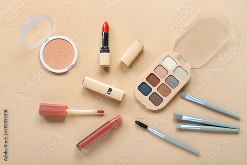 Composition with different decorative cosmetics on color background