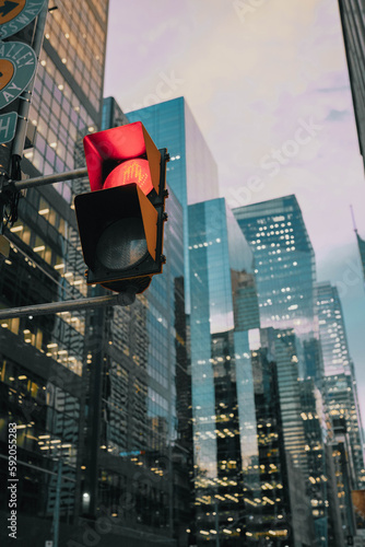 traffic lights with a background of modern skyscrapers in the Financial District of downtown Toronto, Ontario. photo