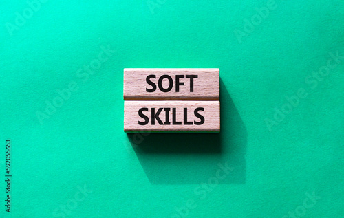 Soft skills symbol. Wooden blocks with words Soft skills. Beautiful green background. Business and Soft skills concept. Copy space.