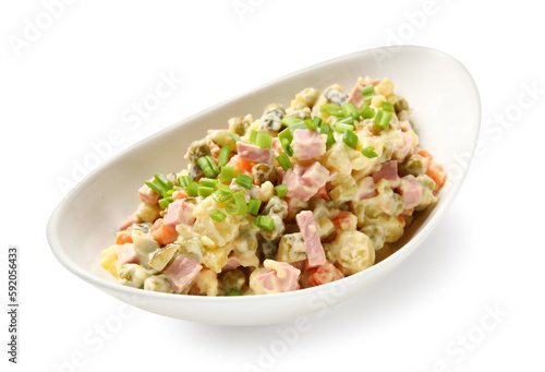 Bowl of tasty Olivier salad on white background