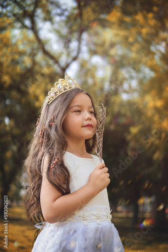 Girl in white dress, fairy tale princess, copy space, children's day theme.