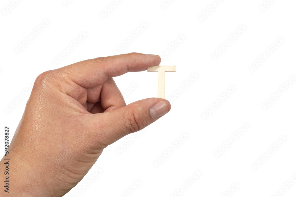Unrecognizable person holding a letter t on a white background Unrecognizable person holding a letter t on a white background