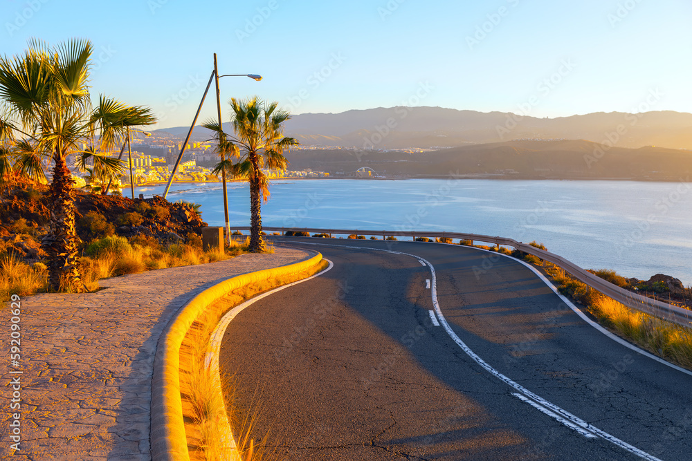 Winding road along the ocean . Driving way in Las Palmas Gran Canaria