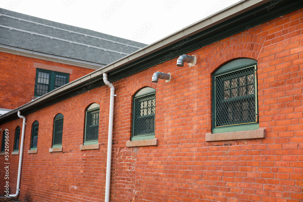 Old brick buildings are a symbol of industrial heritage, innovation, and hard work. They represent the industrial revolution and the rise of manufacturing and industry