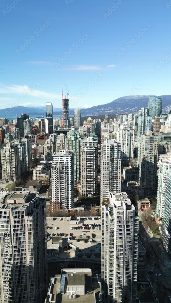 Vertical video. Aerial view of the skyscrapers in Downtown of Vancouver, Canada Vertical video. Aerial view of the skyscrapers in Downtown of Vancouver, Canada