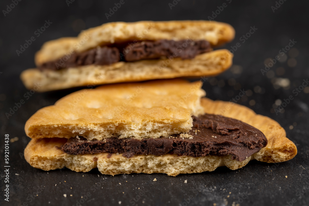 crispy cookies with chocolate filling between cookies crispy cookies with chocolate filling between cookies