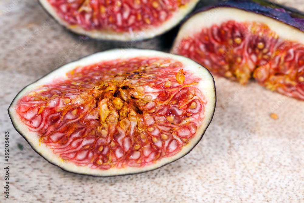 sliced ripe fresh purple figs, close up sliced ripe fresh purple figs, close up