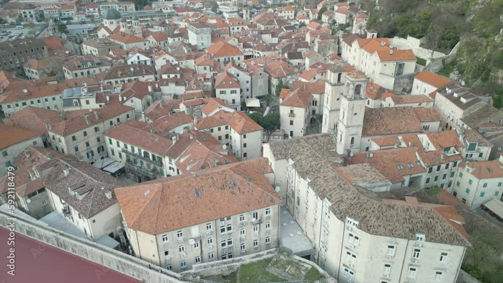 Fast drone dolley shot over downtown Kotor with colorful roofs in Montenegro. Fast drone dolley shot over downtown Kotor with colorful roofs in Montenegro.