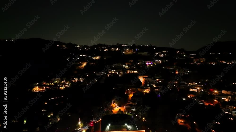 Suburban neighborhood of Hollywood Hills, California at night - pull back aerial reveal Suburban neighborhood of Hollywood Hills, California at night - pull back aerial reveal