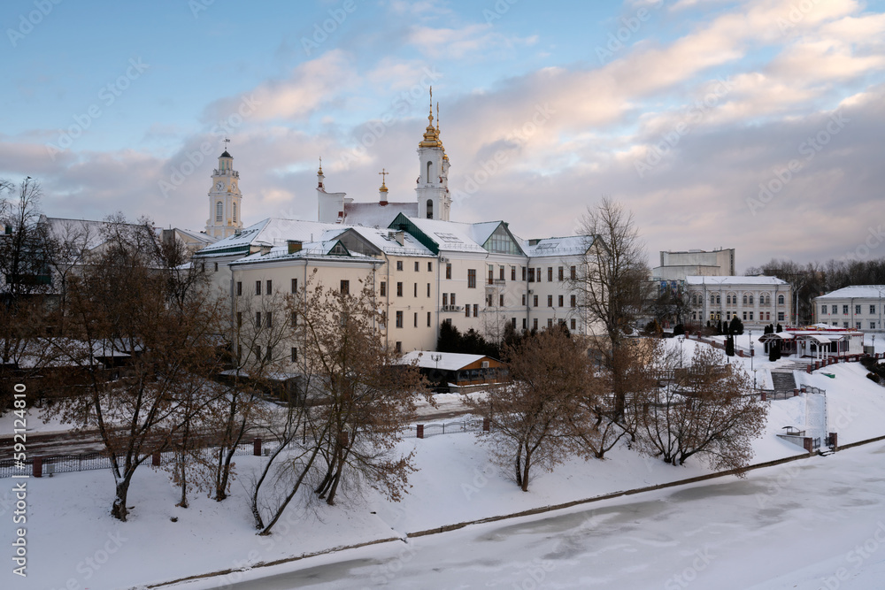 View of the Vitba River embankment, the Town Hall and the Church of the Resurrection of Christ on a winter day, Vitebsk, Belarus