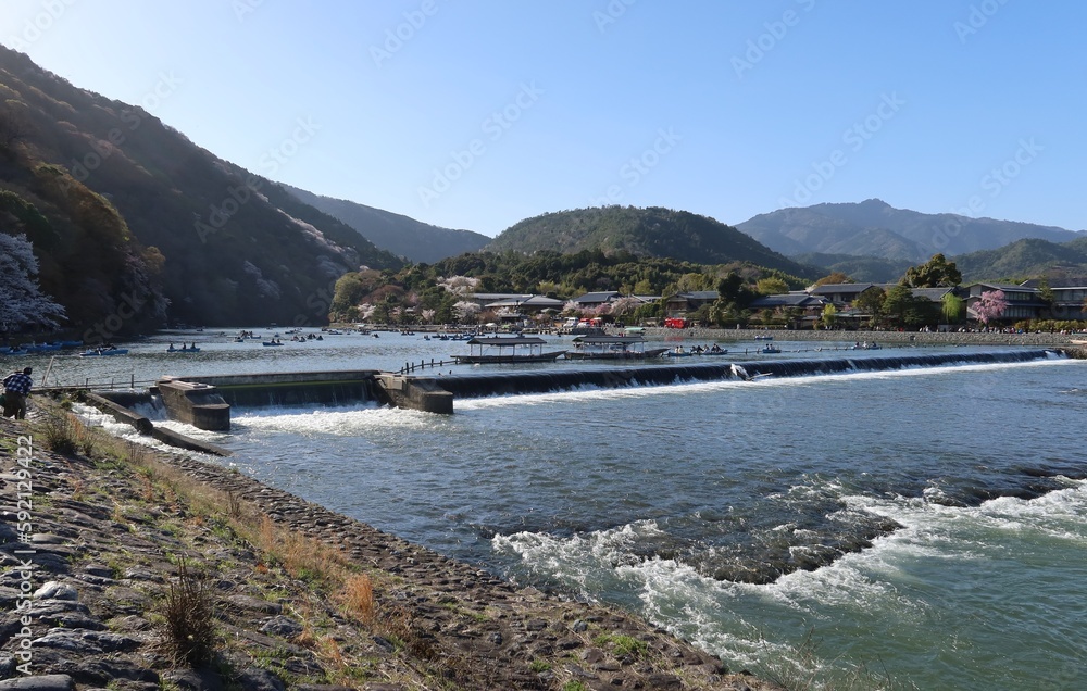 The scene of excursion boats and Hozu-gawa River at Arashiyama in Kyoto City in Japan 日本の京都市嵐山の遊覧舟と保津川