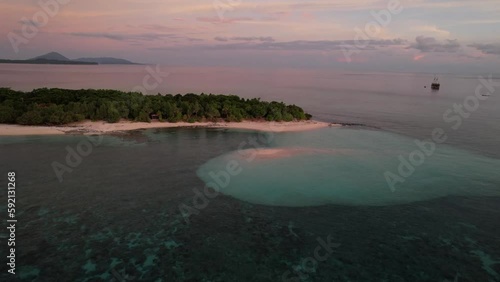 Beautiful view of tropical island during sunset in Banda Sea photo