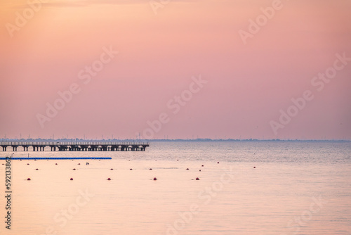 Background of sky and sea, sea is very calm with gentle ripples, sky perfectly clear. © Dmitrii Potashkin