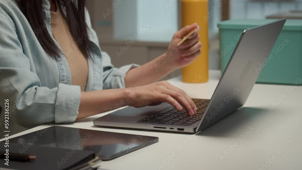 Woman using laptop for online shopping and use credit card for paying, purchase product in online shop. Woman using laptop for online shopping and use credit card for paying, purchase product in online shop.