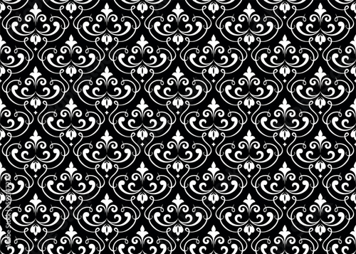Wallpaper in the style of Baroque. Seamless vector background. White and black floral ornament. Graphic pattern for fabric, wallpaper, packaging. Ornate Damask flower ornament