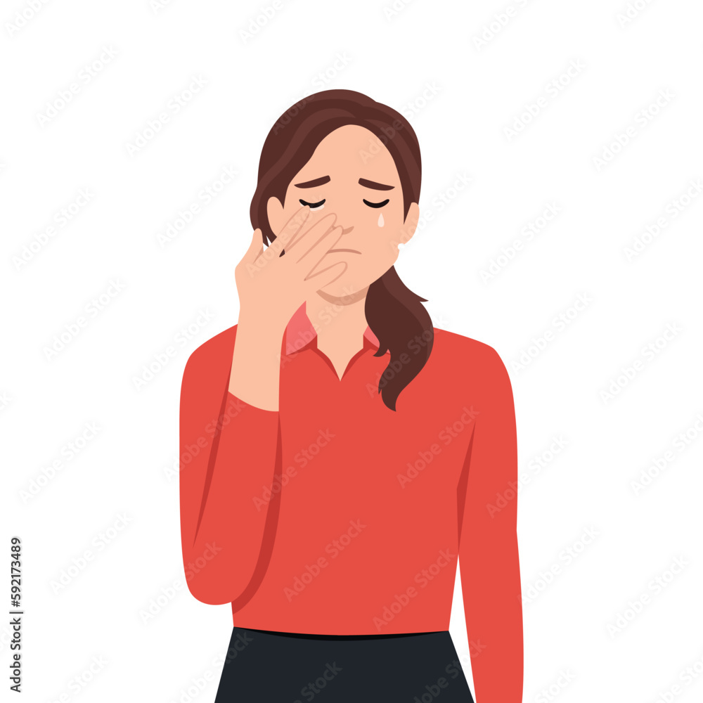 Young woman sad and holding back tears with her hand. Young woman sad and holding back tears with her hand.