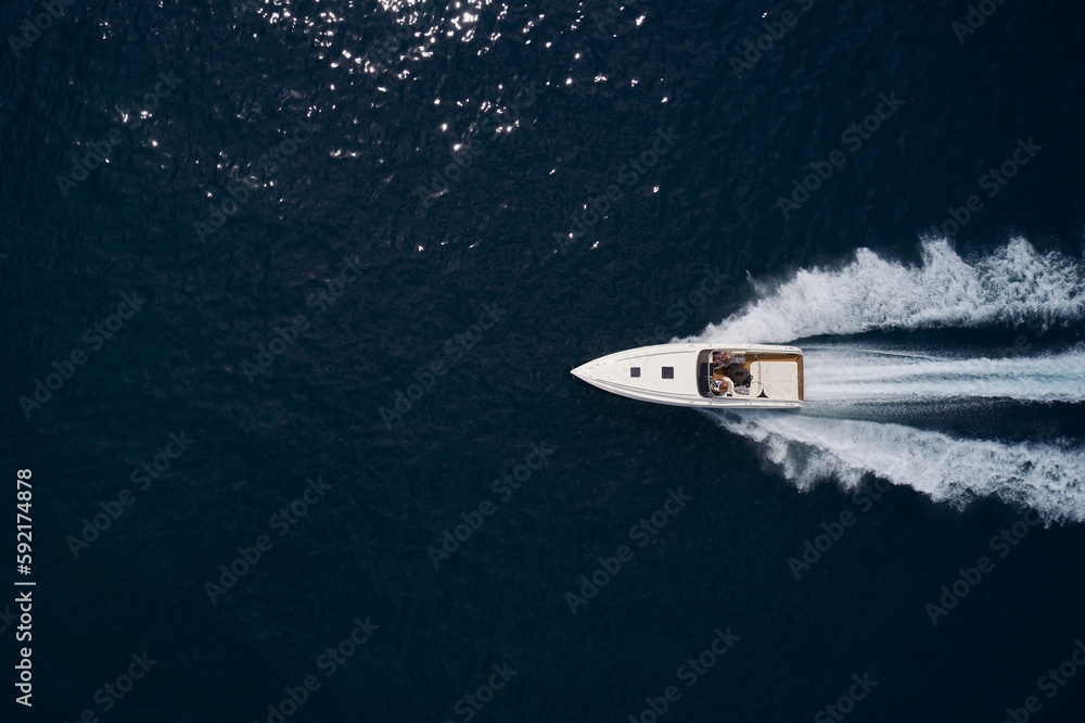 custom made wallpaper toronto digitalLarge speed boat moving at high speed. Top view of a white boat sailing to the blue sea. Travel - image.Drone view of a boat sailing. Motor boat in the sea.