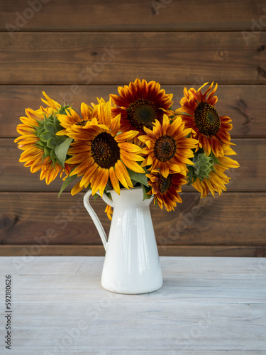 Bouquet of sunflowers in white vase