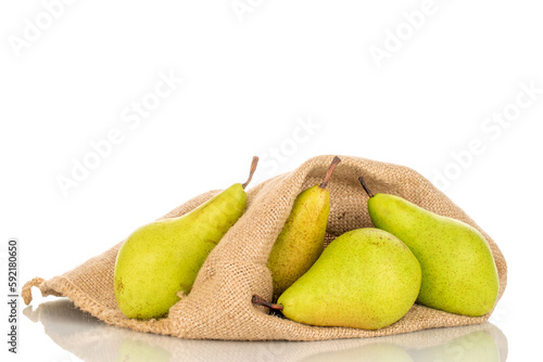 Four sweet pears in a jute sack, macro, isolated on white background.