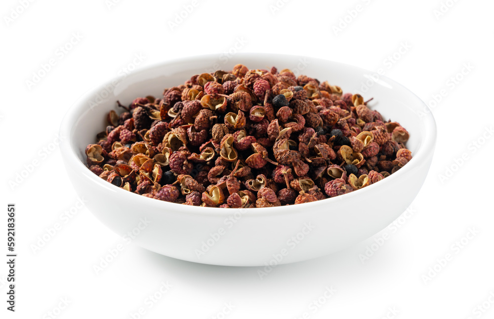 Sichuan pepper in a white bowl set against a white background. Sichuan pepper in a white bowl set against a white background.