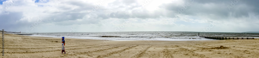 A view along Alum Chime beach at Bournemouth, Dorset, UK in April 2023