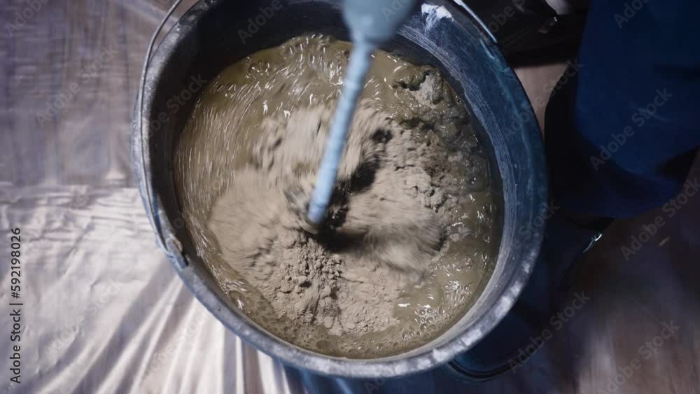 The process of preparing tile adhesive or cement mortar. Mechanical
