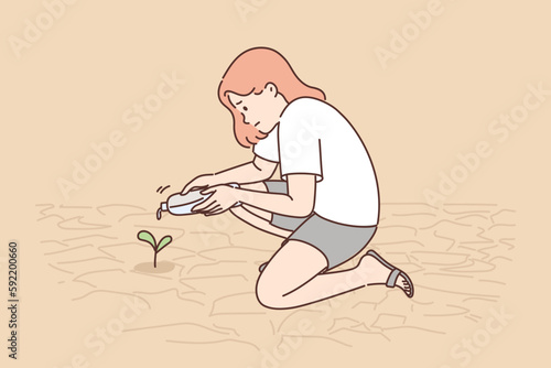 Teenage girl watering plants growing from dry soil or in need of moisture due to lack of rain