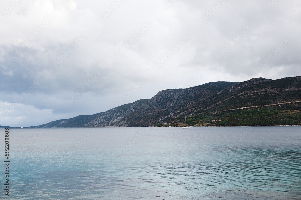 The coastline of the island of Korcula in southern Croatia and the view of the Peljesac peninsula.