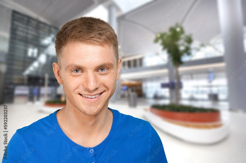 Young happy man posing and looking at camera Young happy man posing and looking at camera