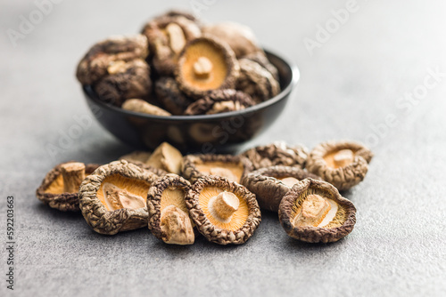 Dried shiitake mushrooms on kitchen table.