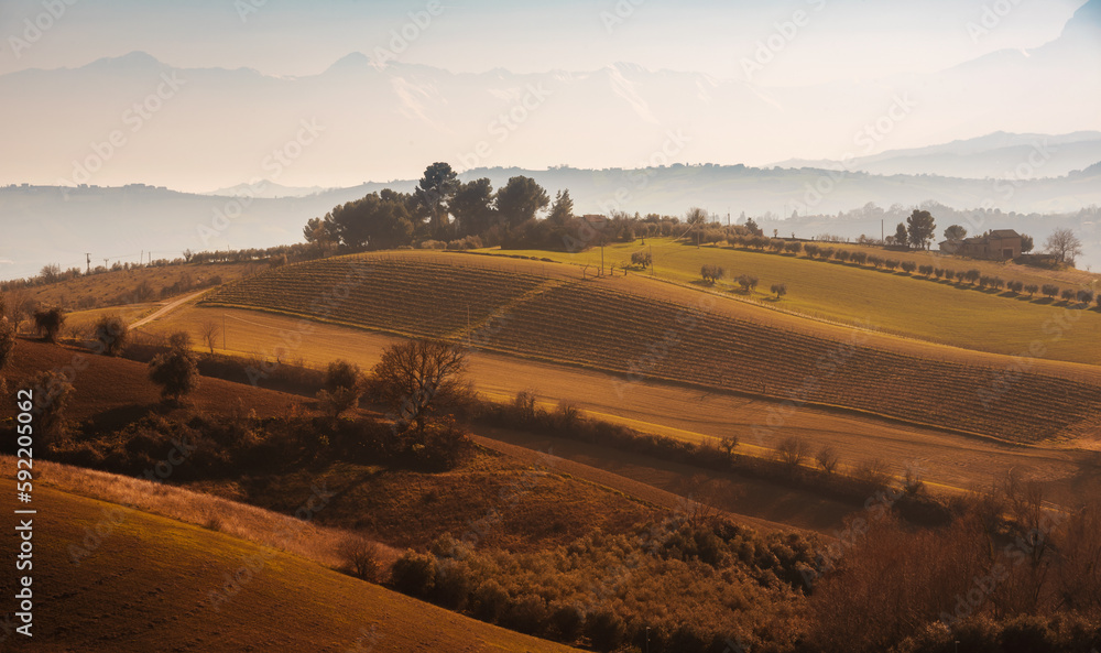 Obraz premium Countryside landscape in autumn, agricultural fields among hills
