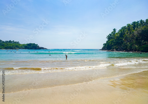 Fototapeta Naklejka Na Ścianę i Meble -  Beautiful tropical landscape on the ocean shore of Sri Lanka. Photography for tourism background, design and advertising.
