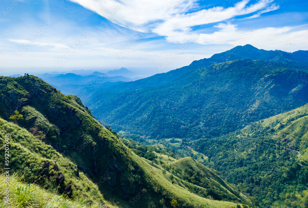 Beautiful mountain tropical landscape with green hills and blue sky. Photography for tourism background, design and advertising. Beautiful mountain tropical landscape with green hills and blue sky. Photography for tourism background, design and advertising.